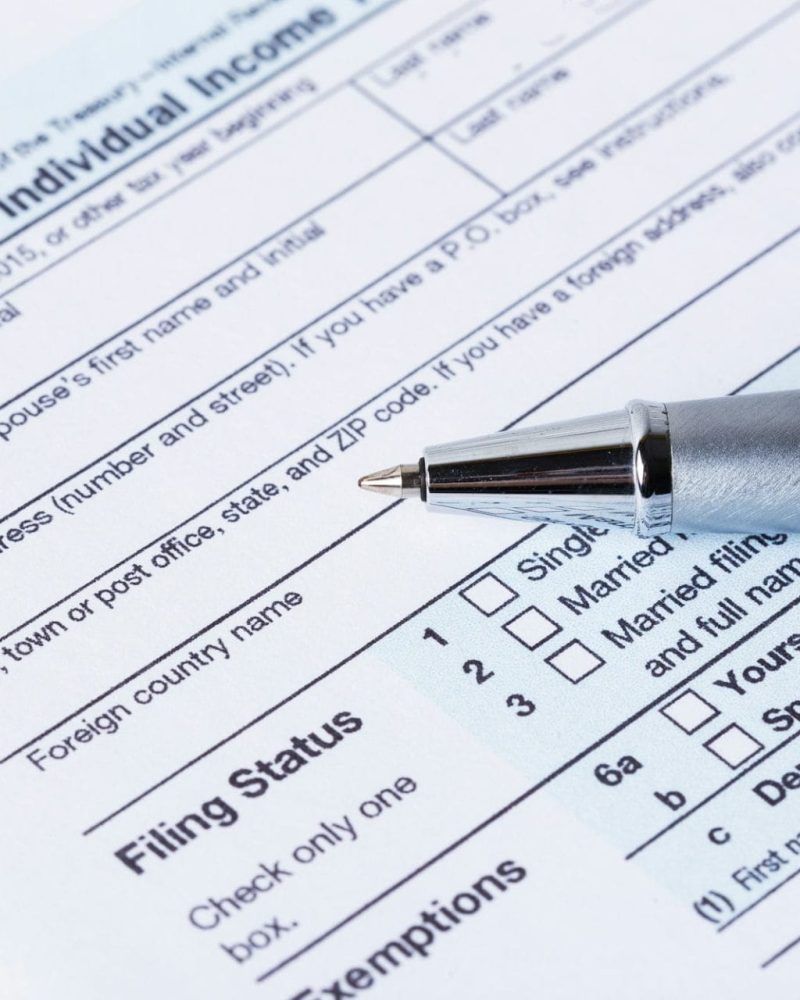 Income tax form and pen